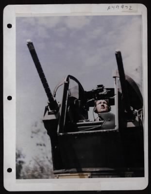 Thumbnail for ␀ > Ssgt Robert S. Smith Of Dallas, Texas, Fortress & Liberator Gunner, Demonstrates Use Of Practice Turret At A Base In New Guinea.