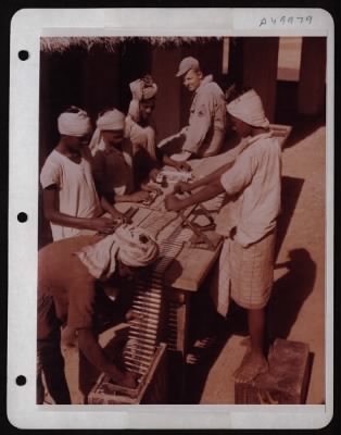 Thumbnail for ␀ > In Far Off India Burma Theatre Indians And Co'S Used To Work Together To Keep The Japs Out Of India.  Now They Work Together To Drive The Japs Out Of Burma.  S/Sgt Donald R. Thompson, El Reno, Ok, Supervises The Loading Of Ammunition Belts For A 10Th Af G