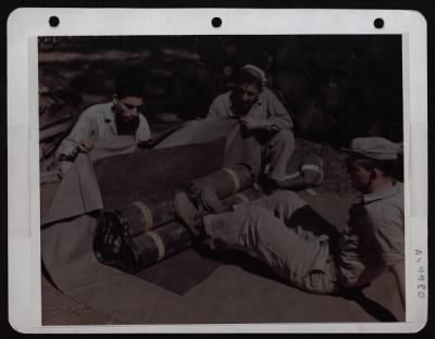 Thumbnail for ␀ > Packing 50Mm Mortar Shells That Will Be Dropped To Advanced Elements Of The 'Mars Task Force' And The Chinese Lst Army In Burma.  This Is One Of Many Problems Solved By Members Of 2Nd Troop Carrier Squadron Of 10Th Af Eastern Air Command.  When Dropped Fr