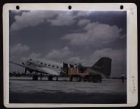 Cargo Is Loaded Into A Douglas C-47.  A Guard Is Standing By The Tail Of The Plane. - Page 1