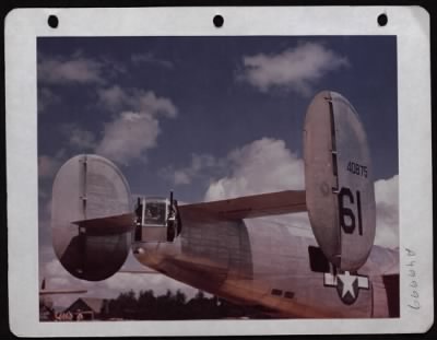 Thumbnail for ␀ > Armament men checks tail turret and tail guns on a Consolidated  B-24 at a base in England.