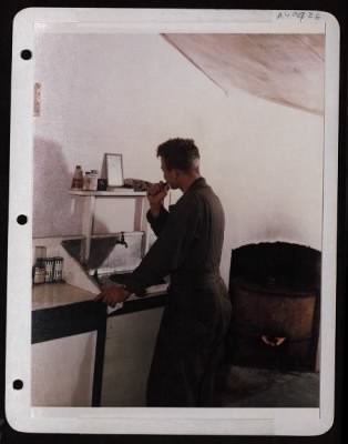 Thumbnail for ␀ > S/Sgt. John E. Emiling Washes Up At Wash Stand In His Stone House, 15Th Af In Italy.