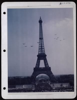 Celebrations > Crowds Of Frenchmen And Allied Soldiers Watch A Display Of Aircraft Fly By The Eiffel Tower In Paris, France, During An Outdoor Exposition Displaying Aircraft And Equipment Used In The Eto.