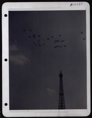 Celebrations > A Large Formation Of Airplanes Flies Over The Eiffel Tower In Paris, France, During An Outdoor Exposition Displaying Aircraft And Equipment Used In The European Theatre Of Operations.