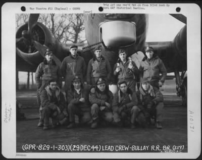 Consolidated > Lead Crew Of Bombing Mission To Attack The Bullay Railroad Bridge, Germany,  Pose In Front Of A Boeing B-17 Flying Fortress.  359Th Bomb Squadron, 303Rd Bomb Group, England.  29 December 1944.