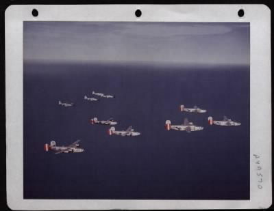 Consolidated > North American P-51'S Give Cover To A Close-Knit Formation Of Consolidated B-24'S Of The 8Th Air Force. England.