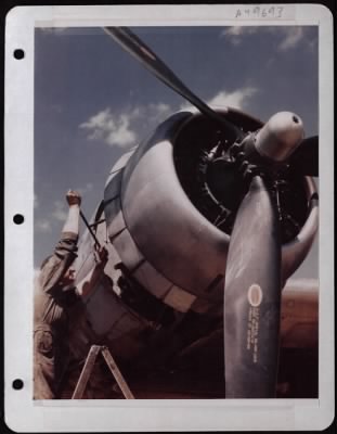 Thumbnail for General > Crew Chief Msgt Herbert H. Roberts, Rosebud, Tex, Repairs A Boeing B-17 Engine.