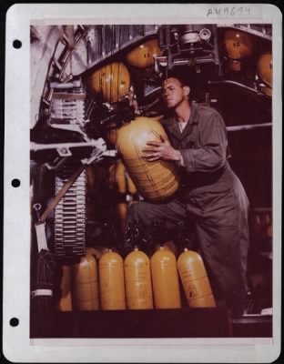 General > Ssgt Clifford Coates, Fairfield, Texas, Regulates Oxygen Valve Inside A Consolidated B-24.