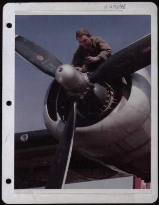 General > Sgt. Arthur Dwyer, Boston, Mass, Works On Engine Of A Consolidated B-24 Of The 8Th Air Force.