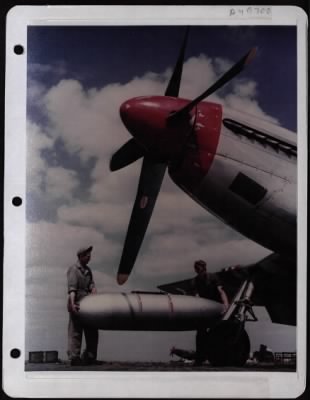 Thumbnail for General > Crew Chiefs Placing Auxiliary Fuel Tank Under Wing Of A P-51