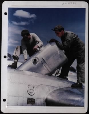 General > Replacing An Oil Tank In A Flak Damaged Boeing B-17 At A Base In England Are, Left To Right: Sgt. Robert Ortega And Sgt. Norval F. Mullen.