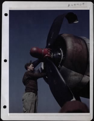 Thumbnail for General > 'Little Miss Mischief' A Boeing B-17 Of The 8Th Af Made A Belly Landing At The Home Base After A Mission Over Germany. Cpl. Irving Flechner Of Bronx, N.Y., Salvage Mechanic, Strips The Engine Of Useable Parts.