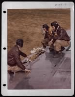 Crew Of The Boeing B-17 'Peacemaker' Examines Battle Damage To The Wing Of The Plane. - Page 1