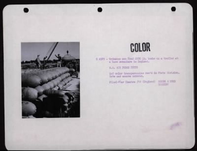 ␀ > Ordnance Men Load 2000 Lb. Bombs On A Trailer At A Base Somewhere In England.