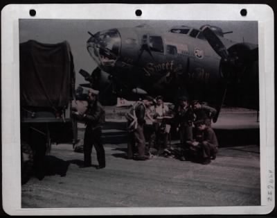 Bomber > An Air Force Navigator On B-17 'Sweet And Lovely' Tosses Flight Bag On Truck After Mission.  Lt. Bradner Makes Report. Eighth Air Force, England.