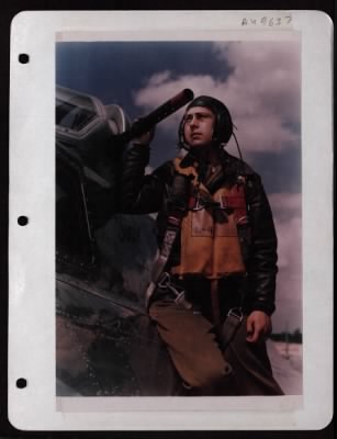 Bomber > Top Turret Gunner S/Sgt. William Kresge, San Bernadino, Calif., Stands On  Wing Beside .50 Cal. Gun. England.