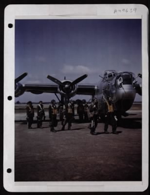 Bomber > Capt. Howard Slaton, Pilot, And His Crew Leave Their Consolidated B-24 At A Base Somewhere In England After A Mission Over Berlin.