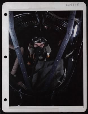 Thumbnail for Bomber > 1St Lt. William C. Lawrence, Bombardier From Astoria, Oregon, At His Position In The Nose Of A Consolidated B-24 At A Base In England.