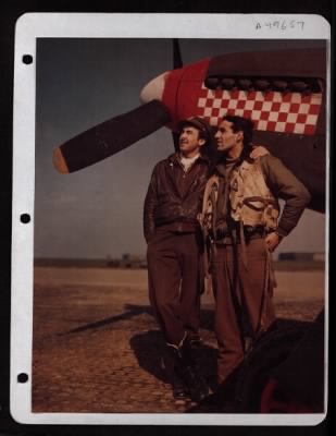 Fighter > England....Captain Don S. Gentile (Right) And His Wingman First Lieutenant Godfrey, Stand Beside The Nose Of A P-51 Mustang.