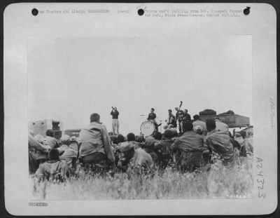 Thumbnail for Consolidated > After their arrival in Italy, these veterans of many campaigns saw their first stage show at the new airbase with no more than a flatbed trailer for a stage. The Mariani Family, an Italian stage troupe under the auspices of the American Red Cross