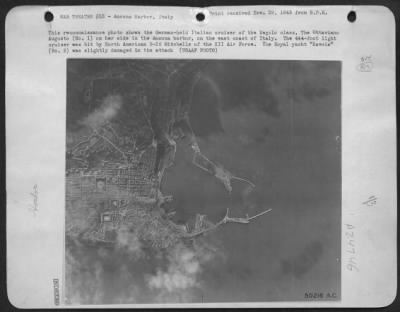 Consolidated > This reconnaissance photo shows the German-held Italian cruiser of the Regolo class, the Ottaviano Augusto (No. 1) on her side in the Ancona harbor, on the east coast of Italy. The 444-foot light cruiser was hit by North American B-25 Mitchells of