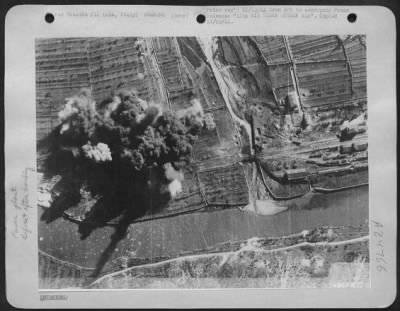 Consolidated > 12TH AIR FORCE ATTACKS ALA-This combat photograph was taken at the height of a B-25 bombing attack by the U.S. Army 12th Air Force on the electric power transformer at Ala, 25 miles north of Verona in Northern Italy. The attack, which produced
