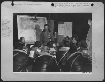 Consolidated > Lt. Colonel Nero Moura, C.O. Of The 1St Brazilian Fighter Squadron Briefs His Unit For Their Initial Mission.  Colonel Moura Has 4000 Hours In The Air And Used To Be Personal Pilot To The President Of Brazil.  Italy