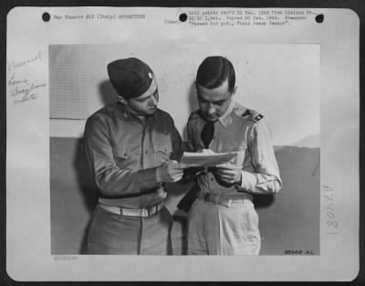Consolidated > Left, Maj. Walter Maciey From Frackville, Pa., An American Liaison Officer With The First Brazilian Fighter Squadron, Discusses The Target For The Day With Capt. Francisco Dutra Sabroza From Rio De Janeiro.  Capt. Sabroza Is A Graduate Of Brazil'S West Po