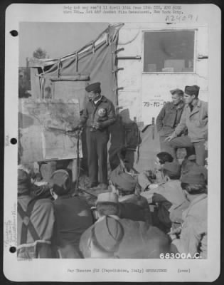 Consolidated > Capt. Bain, Group Operations Officer Of The 79Th Fighter Group, Explains To Ground Crews, The Reason For Moving From Termoli To Capodichino, Italy.