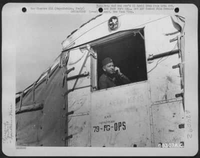 Consolidated > Maj. Macewen Of Group Operations Looks Out Of A Window As Planes Of The 79Th Fighter Group Return To Their Home Base At Capodichino, Italy After A Mission.