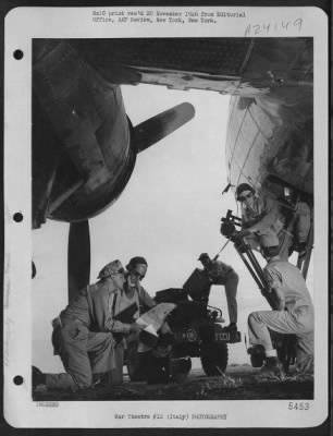 Thumbnail for Consolidated > Aerial Cameramen Of The 1St Combat Camera Unit Load Their Equipment Aboard A 15Th Air Force Boeing B-17 "Flying Fortress" In Italy Just Before The Bomber Takes Off On A Combat Mission.  One Combat Camera Unit Man Flies With Each Bomber Mission.