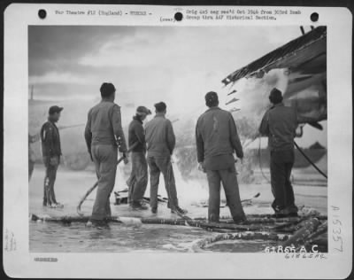 Thumbnail for Consolidated > Fire Fighters Use Foamite To Extinguish Flame In The Wing Of A Boeing B-17 Flying Fortress.  303Rd Bomb Group, England.  20 October 1944.