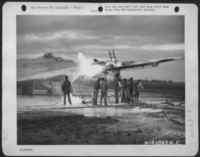 Consolidated > Fire Fighters Use Foamite To Extinguish Flame In The Wing Of A Boeing B-17 Flying Fortress.  303Rd Bomb Group, England.  20 October 1944.