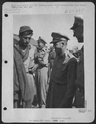 Consolidated > Left To Right: 2Nd Lt. Theodore F. Hastings (Holding Medal) Of 15 Washington Place, Wallington, Nj, Talking With Major General Nathan F. Twining And Gen. C.F. Born.  Lt. Hastings Just Landed At A 15Th Air Force Base In Italy From An Internment Camp In Rum
