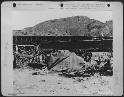 Thumbnail for Consolidated > The Recurring Newspaper Phrase '9Th Af Medium Bombers Disrupted Enemy Rail Communications' Is Illustrated By This Photo Of The Bad Munster Rail Bridge After An Attack By Martin B-26 Marauders Of Major General Samuel E. Anderson'S 9Th Bomb. Div.  The Struc