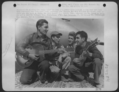 Consolidated > Sometimes The Sweating Out Ordeal Takes The From Of A Little Close Harmony.  A Song That Will Take Them Completely Away From Their Work, Something Like 'Nothing Can Stop The Army Air Corps'.  Left To Right Are, Pfc. Henry A. Crete, 24, 1310 Randall S., Be