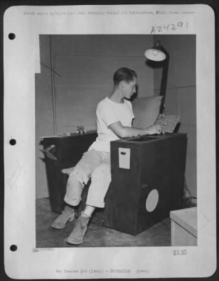 Consolidated > Sgt. Ray Petit, 24, Cambridge Springs, Pa., A Radio Mechanic, 15Th Af Based In Italy, Is Shown Sitting In An Ultra Easy Chair Which He Built From Belly Tank Crates.  It Has Built-In Ash Trays, Radio, Reading Light, Magazine Rack, Compartments, Adjustable