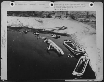 Consolidated > Barges Sunk -- These Barges Have Sunk In A Turn Around In The Wesel Area When The 1St Allied Airborne Army Dropped March 24Th 1945.  This Picture Was Made From A Consolidated B-24 Liberator, One Of The Force Of 240 Us 8Th Af 2Nd Air Division Bombers That