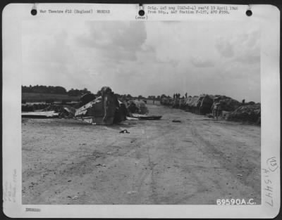 Consolidated > Remains Of A Republic P-47 (A/C 42703) Of The 353Rd Fighter Group Are Scattered Among Fuel Drums And Other Supplies At An 8Th Air Force Base In England.  17 August 1943.