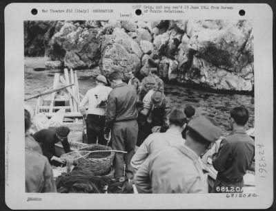 Thumbnail for Consolidated > Two American Red Cross Girls Join 20 War-Weary Youths Of The 15Th Army Air Force On Tour Of The Famous Grottoes Along The Italian Seacoast.  Here, The Group Boarded Four Hired Rowboats At The Small And Colorful Fishing Village.  Local Fishermen, Anxious T