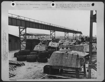 Consolidated > Tank Treads And Panther Tank Turrets Were Stacked In A Storage Yard Adjacent To The Production Line.  The Rails For The Overhead Crane, Used To Lift And Transport These Heavy Parts To The Main Assembly Line, Have Been Knocked Out Of Line And Partially Des