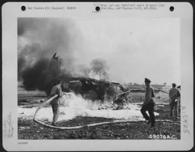 Thumbnail for Consolidated > Fire Fighters Of The 353Rd Fighter Group Make A Successful Attempt To Extinguish The Fire Of A Burning Republic P-47 (A/C 42-7985) Which Crashed At Their Base In England On 19 September 1943.