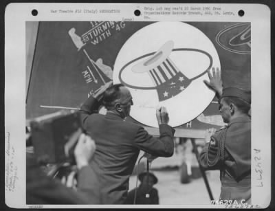 Consolidated > Capt. Eddie Rickenbacker Autographs The 94Th Fighter Squadron Insignia On A Poster At A 94Th Fighter Squadron, 1St Fighter Base In Italy.