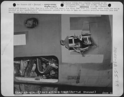 Consolidated > Martin B-26 damaged by flak. They come home when flak damage is no worse than this. U.S. planes, while tough, are not as AA-proof as some manufacturers' advertisements indicate so it pays to take all possible anti-flak measures. This B-26