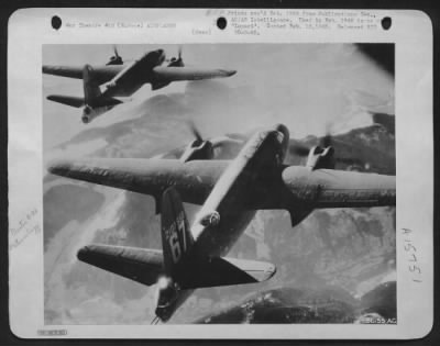 Consolidated > Martin B-26 Marauders flying over the Alps. This impressive photograph was taken from one of a fleet of Marauder aircraft which were on their way to attack vital targets in south-west Germany. It will be noted that the strong icy winds have