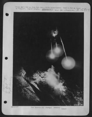 Consolidated > NIGHT ATTACK ON U-BOAT. Dropping flares, an RAF Coastal Command plane attacks a German sub from 75 feet. Depth charge can be seen exploding near the center of the picture. EUROPE.