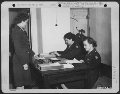 Thumbnail for Consolidated > After A Snappy Salute, Pvt. Mary V. Koehl Of Akron, Ohio, Receives Her Monthly Pay From The Air Wac Platoon'S Commanding Officer At 12Th Air Force Headquarters, Capt. Verna A. Mccluskey Of Birmingham, Alabama (Left) While 1St Lt. Mary Crook Of Minneapolis