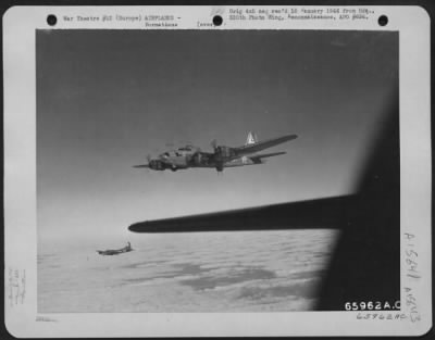 Consolidated > Two Boeing B-17 Flying Fortresses Of The 381St Bomb Group, En Route To Bomb Enemy Installations In Europe, Are Only Part Of The Attacking Formation.  Far In The Distance, Appearing As Tiny Specks In The Sky, Other Fortresses Roar Toward The Target.