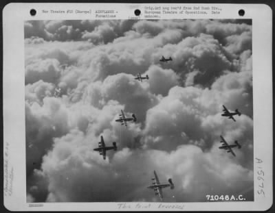 Consolidated > A Formation Of Consolidated B-24 Liberators Roars Over A Blanket Of Clouds En Route To Their Target Somewhere In Europe.  2Nd Bomb Division, 24 November 1944.