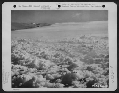 Consolidated > A Formation Of Consolidated B-24 Liberators Of The 2Nd Bomb Division, Flies Over The Fleecy Clouds That Hide The Countryside Below As They Wing Their Way To Bomb Enemy Installations Somewhere In Europe.  24 November 1944.